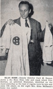 Deason holding Klan robe