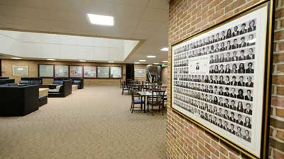 Lobby with seating and graduate composite photo in foreground
