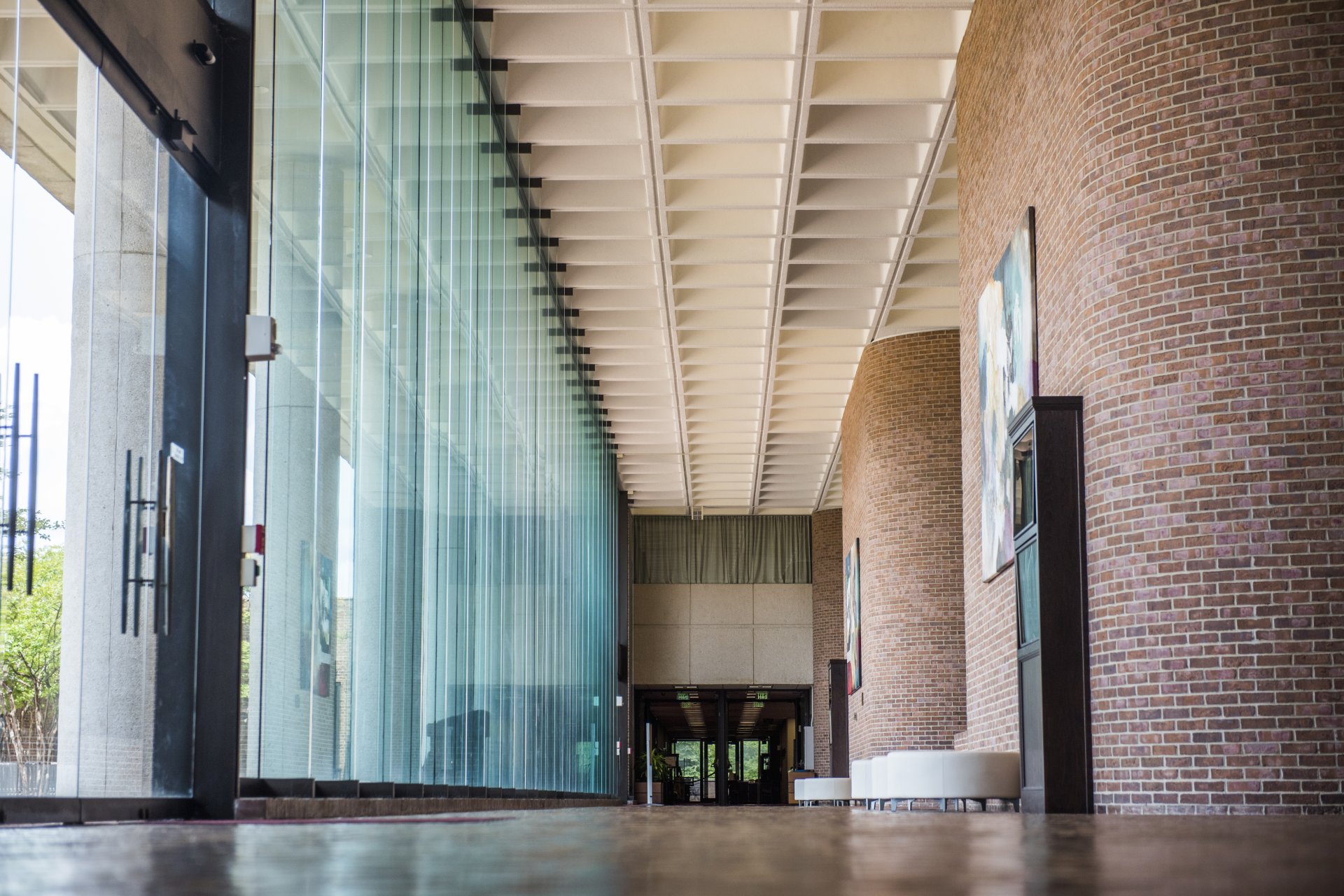 Law School atrium with windows to the left and brick walls to the right