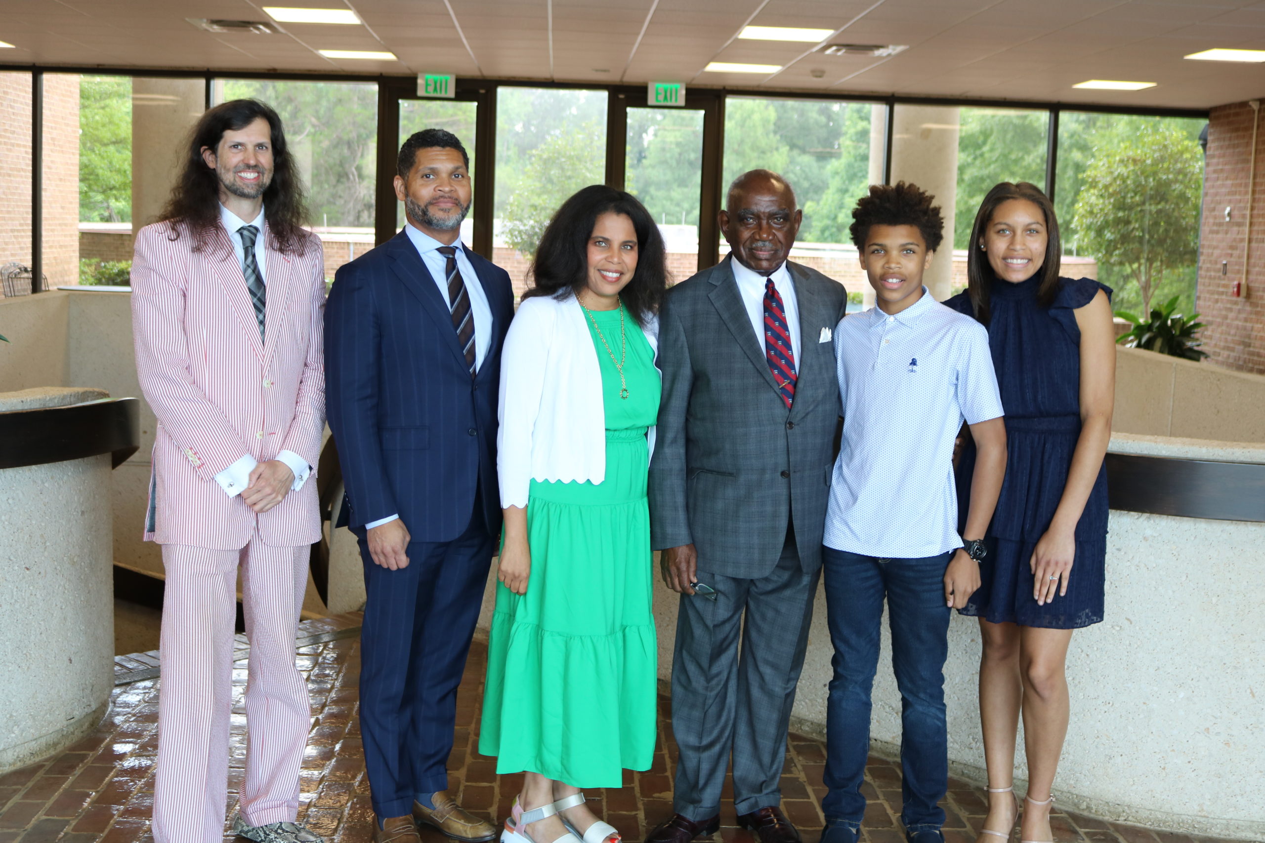 former US District Judge U.W. Clemon, Derrick Mills and family pose for picture with Professor Anil Mujumdar, Director of the Alabama Law Summer Scholars Program.